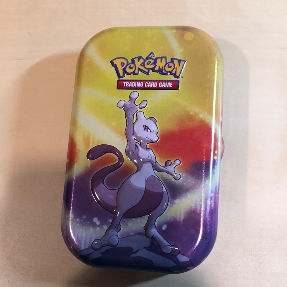 Pokémon tin with character card